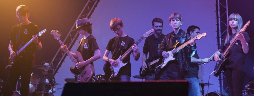 Children performing with Richard at The Rock Project concert.